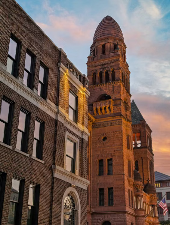 The historic Bexar County Courthouse tower at sunset in San Antonio, Texas
