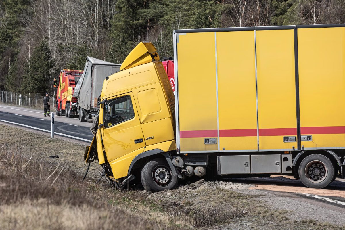 Wrecked commercial truck off the roadway after a highway collision